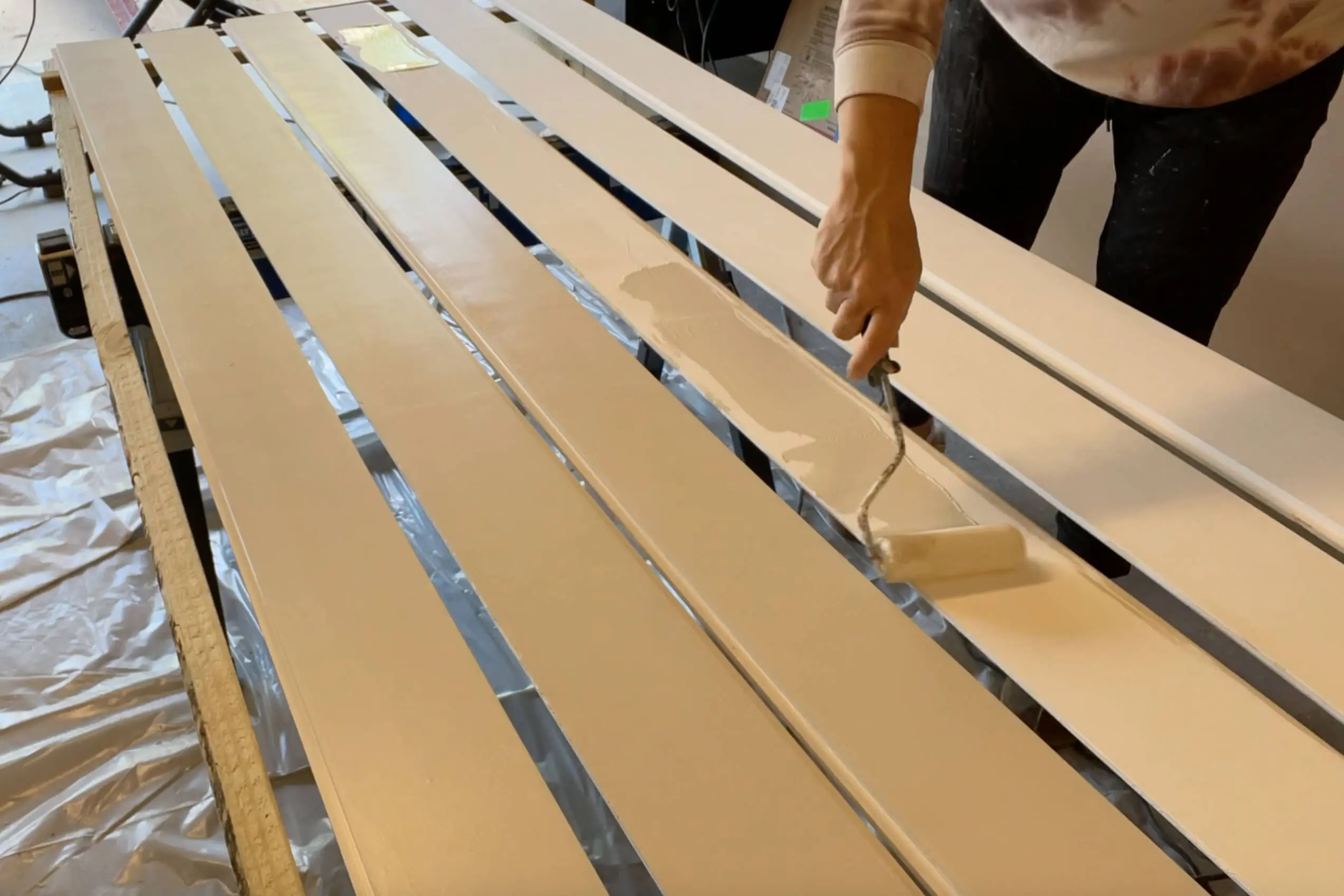 Painting a shiplap backsplash.